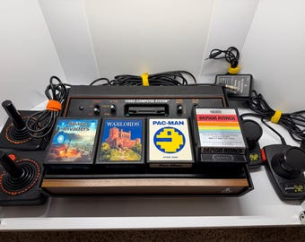 CLEAN Polished Atari 2600 console w/ LED Light Mod, 4 cleaned games, 2 cleaned & renewed joysticks, set of paddles, ac cord, and RF connect.