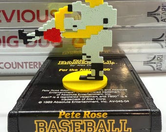 3-D-printed action pose of the pitcher from Pete Rose Baseball for the Atari 7800. Figurine comes with a stand for the display purposes.