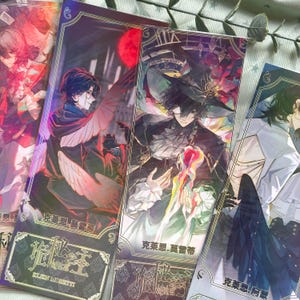 May include: A set of four rectangular bookmarks featuring anime-style illustrations of characters with dark hair, wings, and ornate clothing. Each bookmark displays intricate borders, Chinese characters, and the English text Klein Moretti.