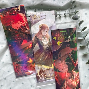 May include: Three rectangular bookmarks featuring Lord of Mystery character illustrations. The left bookmark shows a red-haired figure, the center displays a woman in a green dress, and the right depicts a character with light hair, all in plastic sleeves.