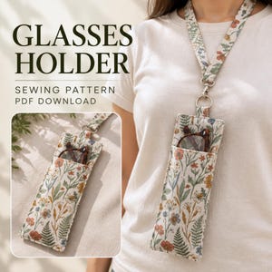 Peut inclure: Un étui à lunettes en tissu avec un motif floral composé de fleurs rouges, jaunes et bleues et de fougères vertes. Il comprend un cordon assorti avec un fermoir en métal argenté. Le texte indique GLASSES HOLDER SEWING PATTERN PDF DOWNLOAD.