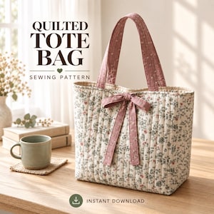 May include: A quilted tote bag sewing pattern featuring a cream-colored fabric with a small green and pink floral print. The bag has two pink floral handles and a matching pink fabric bow tied at the center. The text reads QUILTED TOTE BAG SEWING PATTERN.
