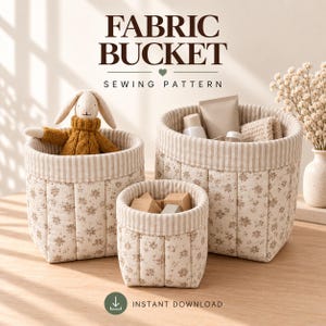 May include: Three quilted fabric buckets in varying sizes featuring a cream and brown floral print with a striped interior lining. The text FABRIC BUCKET SEWING PATTERN and INSTANT DOWNLOAD are visible. One bucket contains a plush rabbit toy.