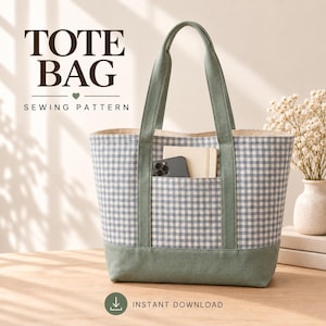 May include: A tote bag sewing pattern featuring a blue and white gingham fabric body with sage green canvas handles and a base. The bag has an exterior pocket containing a smartphone and a notebook. Text reads TOTE BAG SEWING PATTERN and INSTANT DOWNLOAD.