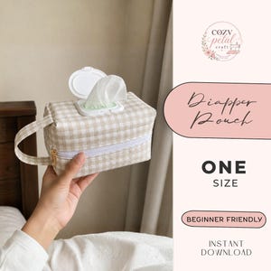 May include: A beige and white gingham fabric nappy pouch with a white plastic flip-top lid and a side handle. The pouch features a white zip closure and holds a single white wipe. Text on the image includes Diapper Pouch, ONE SIZE, BEGINNER FRIENDLY, and INSTANT DOWNLOAD.