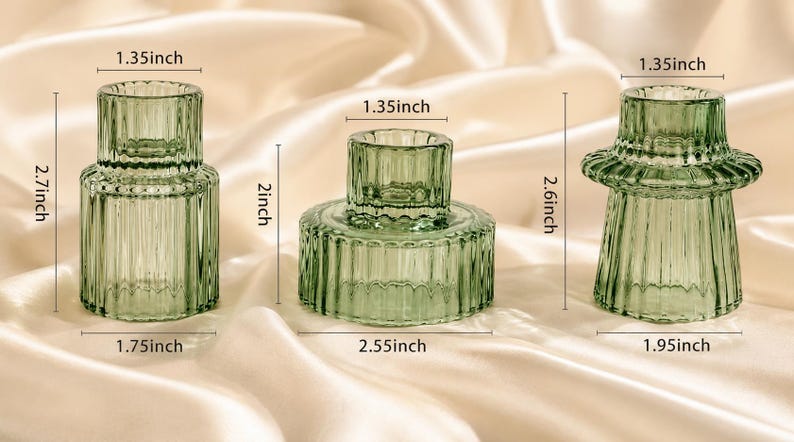 three reversible candle holders in forrest green against a cream silk background with clear dimensions visible.