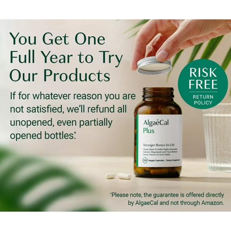 May include: A brown glass bottle of AlgaeCal Plus veggie capsules with a white label featuring text about bone health. The bottle has a silver lid being opened. Two capsules lie on the surface. Text on the image details a one-year return policy.