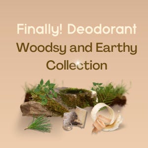 May include: A promotional graphic with the text Finally! Deodorant Woodsy and Earthy Collection. The image features a moss-covered rock, green fern leaves, a pine needle sprig, a small piece of bark, and light-colored wood shavings.