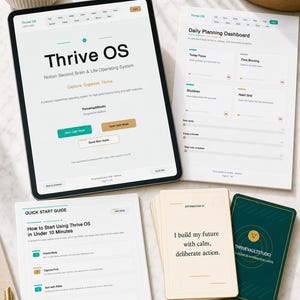 May include: A digital tablet shows the "Thrive OS" interface, with printed guides and affirmation cards. The tablet has options for light and dark modes. The affirmation cards have text that reads "I build my future with calm, deliberate action."
