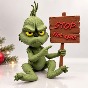 May include: A green, textured figurine of a creature with yellow eyes and a furrowed brow, sitting and pointing at a brown wooden sign. The sign features the red text STOP and the red cursive text Not again, held by a wooden post.