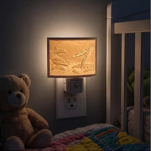 May include: A beige night light with a rectangular shade featuring a 3D relief of sea turtles and dolphins. The night light is plugged into a white wall outlet, illuminating a child's bedroom. A teddy bear sits nearby.
