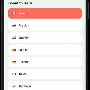 May include: A smartphone screen displaying a language learning application interface. The screen shows the text My native language with English selected, followed by I want to learn with a list of languages including French, Russian, Spanish, Turkish, German, Italian, Japanese, and Korean, and a Continue button at the bottom.
