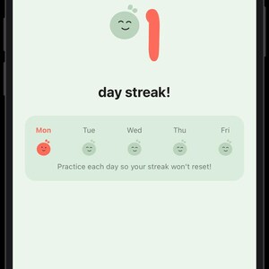 May include: A smartphone screen displays a mobile application interface with a light green background. A large red number one is next to a small green smiling character. The text reads day streak! and Practice each day so your streak won't reset!