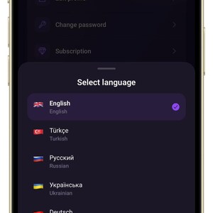 May include: A smartphone screen displaying a dark-themed settings menu with an overlay titled Select language. The list includes English, T&uuml;rk&ccedil;e, Русский, Українська, Deutsch, Fran&ccedil;ais, and Italiano, each accompanied by a national flag icon.