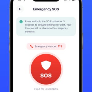 May include: A smartphone screen displaying an Emergency SOS app interface with the text HELP IS ONE TAP AWAY. The screen shows instructions to press and hold the red SOS button for 3 seconds, an emergency number 112, and an add contact option.
