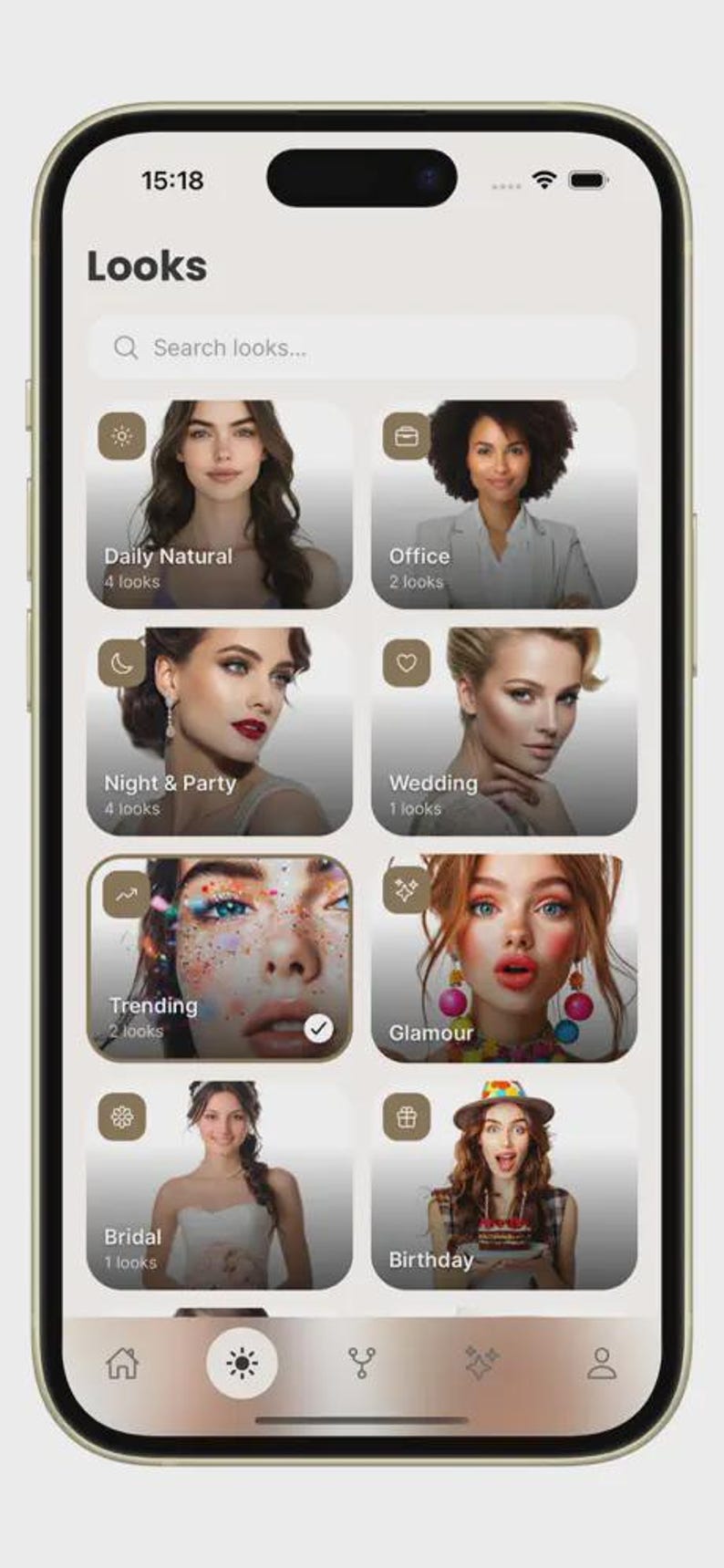 K&ouml;nnte beinhalten: Ein Smartphone-Bildschirm, der die Benutzeroberfl&auml;che einer mobilen App mit dem Titel Looks anzeigt. Der Bildschirm enth&auml;lt eine Suchleiste und acht rechteckige Kacheln mit verschiedenen Make-up-Stilen, beschriftet als Daily Natural, Office, Night & Party, Wedding, Trending, Glamour, Bridal und Birthday, sowie eine Navigationsleiste am unteren Rand.