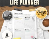 The ADHD Life Planner monochrome edition 2026 2027 printable, plan by energy daily page in black and white on a desk, 345 pages, 5 sizes, fill in on screen