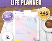 The ADHD Life Planner lavender edition 2026 2027 printable, plan by energy daily page in soft lavender colours on a desk, 345 pages, 5 sizes, fill in on screen