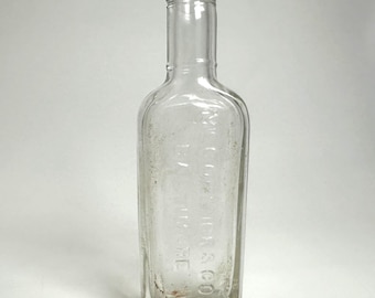 McCormick & Co Glass Bottle 5in Clear Embossed Baltimore Vintage Spice