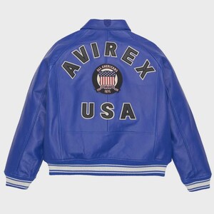 May include: A royal blue leather jacket with white and black accents. The back features the word "AVIREX" arched across the top, with "USA" below a circular patch with an American flag design. The jacket has a classic bomber style.