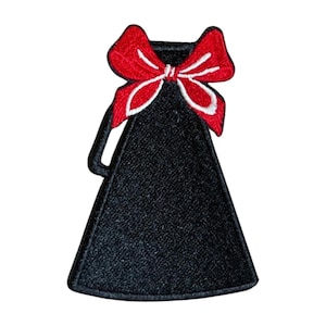 May include: Black megaphone patch with a red bow and white trim. The megaphone has a handle on the side and a flared base. The bow is a prominent feature, adding a decorative element to the patch.