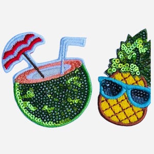 May include: Two embroidered patches: a coconut drink with a red and blue umbrella and a blue straw, and a pineapple wearing blue sunglasses. Both patches are embellished with green sequins.
