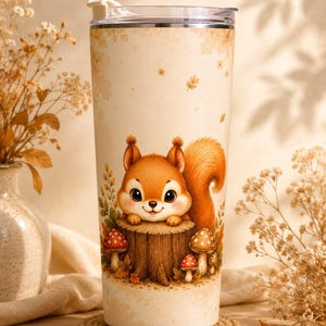 May include: A cylindrical tumbler with a cream-colored background featuring a graphic illustration of a brown squirrel resting its paws on a tree stump surrounded by small red and white mushrooms, topped with a clear lid and a white closure.
