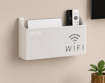 May include: A white wall-mounted storage organiser with a vertical ribbed texture. The front features the text COLNSE and a WiFi symbol with the word WIFI below it. Inside are a white electronic device, a black remote, and a white remote control.