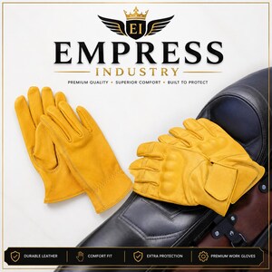 Könnte beinhalten: Ein Paar gelbe Lederhandschuhe mit verstärkter Knöchelpolsterung und einem Handgelenkriemen. Der Markenname Empress Industry steht oben, darunter der Text Premium Quality, Superior Comfort, Built to Protect.