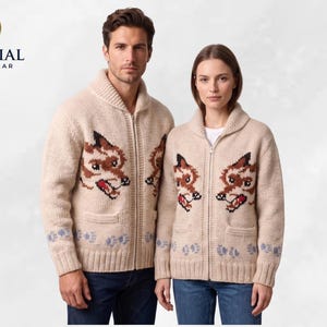May include: Beige zip-up cardigan sweaters with a fox face design on the front. The sweaters have a shawl collar, pockets, and blue paw print accents on the cuffs. The logo "IMPERIAL OUTERWEAR" is in the upper left corner.