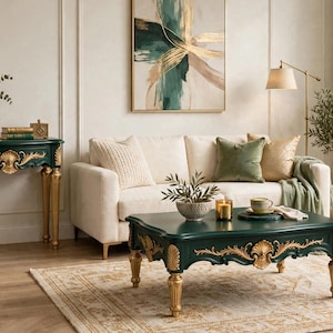 May include: A dark green coffee table with gold-painted carved accents and four fluted legs. The rectangular table features a smooth surface and ornate decorative detailing along the apron, finished with a polished sheen.