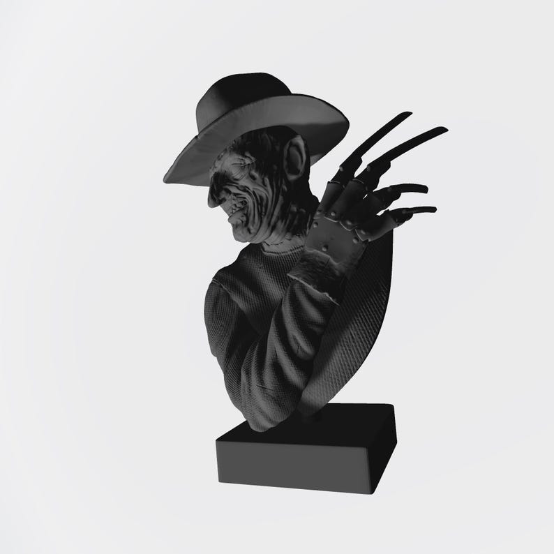 May include: A monochromatic gray bust sculpture depicting a figure wearing a wide-brimmed hat and a textured sweater. The figure has a scarred facial appearance and a glove with long, sharp, blade-like fingers extended upward on the left side.