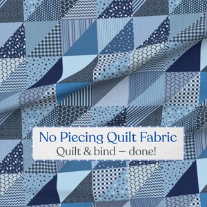 May include: A blue fabric featuring a printed patchwork design of triangles in various shades of navy, medium blue, and light blue with geometric patterns. A white rectangular label reads: No Piecing Quilt Fabric, Quilt & bind – done!