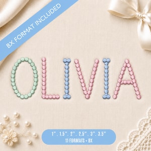 Puede incluir: Un diseño de bordado con el nombre OLIVIA formado por cuentas circulares individuales. Las letras son de color verde claro, rosa y azul. Una banda azul en la parte superior dice BX FORMAT INCLUDED y una banda inferior enumera 1, 1.5, 2, 2.5, 3, 3.5 cm.