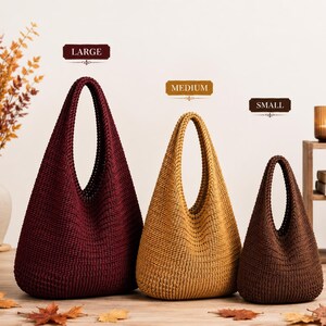 May include: Three hobo-style bags in varying sizes and colors. The large bag is deep burgundy, the medium bag is mustard yellow, and the small bag is dark brown. Each bag features a textured, woven knit construction with a single integrated handle.