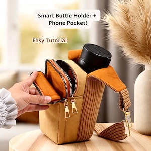 May include: A tan and orange smart bottle holder with a phone pocket. The holder has a black bottle inside and a zippered pocket. The text "Smart Bottle Holder + Phone Pocket!" and "Easy Tutorial" are visible.