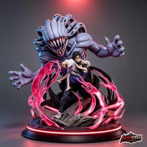 May include: A detailed anime-style figurine featuring a dark-haired character holding a smaller figure, protected by a large, purple, multi-tentacled creature with sharp teeth. The base includes glowing pink energy effects and rocky terrain.