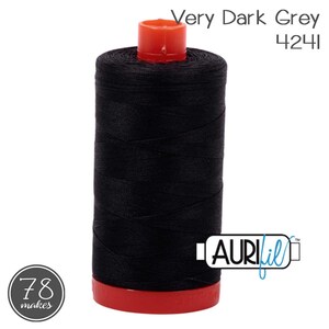 May include: A spool of very dark grey sewing thread with the text Very Dark Grey 4241, featuring a bright red plastic base and top cap. The spool includes the AuriFil brand logo and a circular 78 makes emblem on the lower left side.
