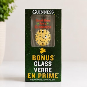 May include: A Guinness glass in a green box. The glass has a clock face design with the text "Good time for a Guinness." The box also says "BONUS GLASS VERRE EN PRIME."