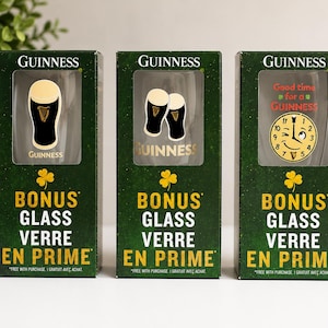 May include: Three Guinness bonus glass boxes. Each box is dark green with gold lettering and a shamrock. The boxes feature images of Guinness glasses and a clock with the text "Good time for a Guinness".
