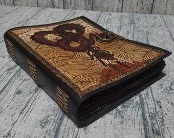Leather and wood adventure tome hollow book dice box with sea serpent loch ness carving on cover