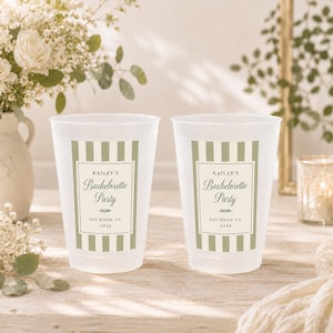 May include: Two frosted plastic cups featuring a sage green and white vertical striped design. The center label reads Kailey's Bachelorette Party, San Diego, CA, 2026, with decorative flourishes. The cups have a smooth, translucent finish.
