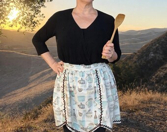 1950s Inspired Bistro Apron: Adorable Cotton Kitchenware Print, Rickrack Accent. Handmade with 100% Cotton, a Sustainable Fiber.