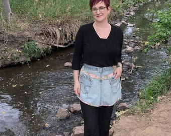 Upcycled jeans apron for kitchen, garden, or home with pink floral fabric accents