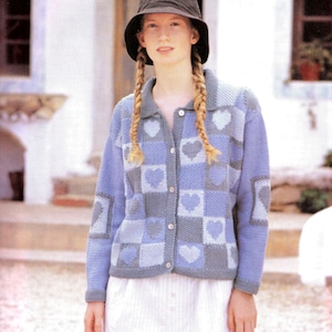 May include: A long-sleeved button-down cardigan featuring a checkered pattern in shades of blue and gray. The knit garment displays alternating squares with heart motifs and textured stitch patterns. It includes a collar and light-colored buttons.