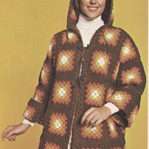 May include: A hooded crochet cardigan constructed from brown, orange, yellow, and white granny squares. The garment features long sleeves, a hood, and a front tie closure, showcasing a repeating geometric pattern throughout the entire piece.