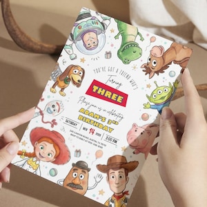 May include: A rectangular birthday invitation card featuring colorful cartoon illustrations of various toy characters. The text reads: You've got a friend who's turning THREE, Please join us in celebrating ADAM'S 3RD BIRTHDAY, SATURDAY NOV 14 2026 2:00 PM.