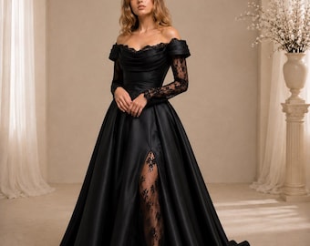 May include: A floor-length black gown featuring an off-the-shoulder neckline, long sheer lace sleeves, and a fitted bodice. The skirt has a high front slit that reveals a black lace panel underneath, and the fabric flows into a wide, full hemline.