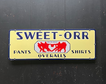 1930s Sweet Orr Pants Shirts & Overalls N.O.S. Porcelain Sign With Tug O'War Graphic | Union Made Workwear General Store Advertising Sign.