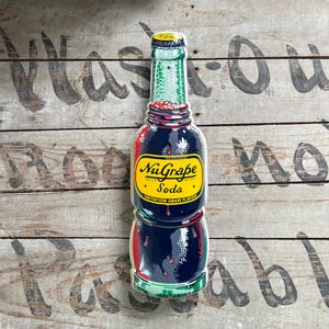 1950s NuGrape Soda Embossed Tin Bottle Sign | N.O.S. Soda Pop Advertising Display | Figural Advertising Bottle Sign.